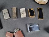 many different types of lighters and lighters laid out on a table