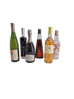 several bottles of wine are lined up on a white surface