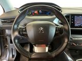 the interior of a car with a steering wheel and dashboard controls