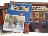three children ' s books are stacked on top of each other in front of a building