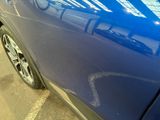 a close up of a car ' s paint job on the side of the car