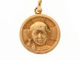 l'image d'une pièce d'or sur laquelle figure l'image d'un homme