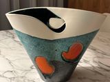 a bowl that is sitting on a marble table