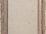 an old wooden frame with a metal latch on it