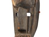 an image of a wooden mask with horns on a white background