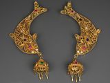 pair of gold - plated earrings with colorful stones and bells