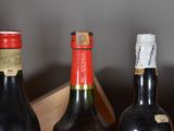 three bottles of wine in a wooden box