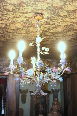 a chandelier that is hanging from the ceiling in the room
