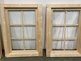 two wooden windows that are next to each other