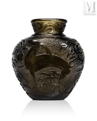 a glass vase with a face on it sitting on a table