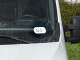 a white van with a sticker on the side of it