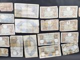 several different types of paper money laid out on a black surface