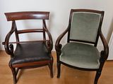 two chairs sitting next to each other on a hard wood floor
