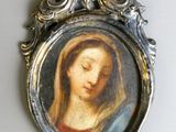 an image of a picture of a woman in a frame on a wall