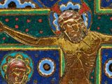 an image of a gold and blue cross with jesus on it