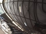 a close up of a motorcycle with a shiny tire