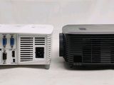 an image of a small projector sitting next to a larger projector