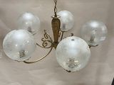a chandelier hanging from the ceiling in a room