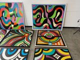 several pieces of art that are on a floor in a room