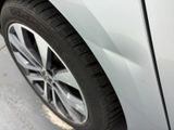 a close up of a car tire on the side of the road