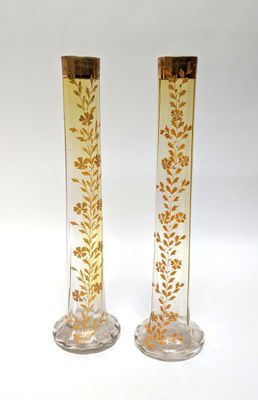 pair of gold and clear glass vases with gold leaves on them