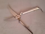 a pair of pliers on a table with a knife