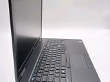 a laptop computer with a keyboard on a white surface