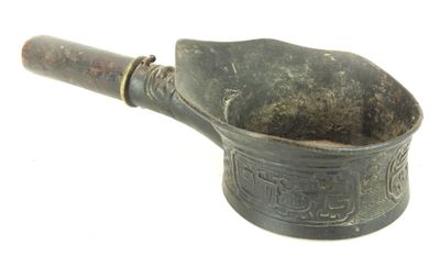 an old mortar with a wooden handle on a white background
