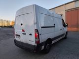a white van that is parked in a parking lot