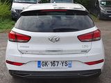a white car that is parked in a parking lot