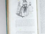 an open book with a picture of a woman in a dress