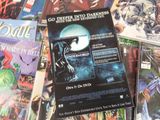 a lot of comic books on the table together