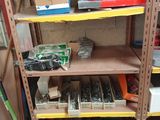 a lot of tools on the shelves in the garage