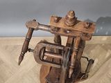 a wooden machine that is on a wooden floor