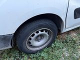 a white truck that has a flat tire on it