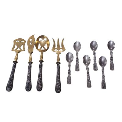 a group of silver and gold spoons and spoon spoons