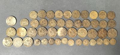 a bunch of coins sitting on top of a table next to each other