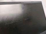 a black laptop computer sitting on a white surface