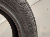 a close up of a tire on a white surface