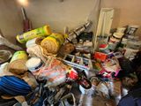a messy room with a lot of stuff on the floor