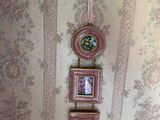 three pictures hanging on the wall of a room