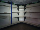 a empty shelf in a store with empty shelves