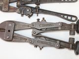 four old wrenes are lined up on a white surface