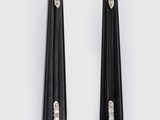a pair of black and turquoise earrings with a tear shaped drop
