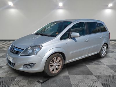 a picture of a silver van parked in a garage