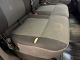 a dirty seat in the back of a car