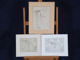 three framed maps on a wooden easel on a blue background