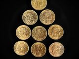 a pyramid of gold coins on a black background