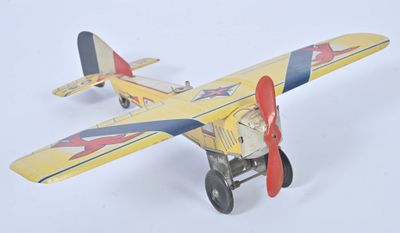 a toy airplane that is sitting on a white surface
