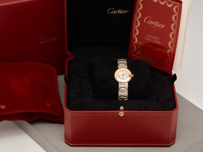 an image of a red box with a watch inside of it